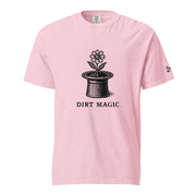 Black vintage-style illustration of a blooming flower growing from a magician's top hat with the words "Dirt Magic" beneath it, rendered in bold botanical line art inspired by classic storybook illustrations on a t-shirt.