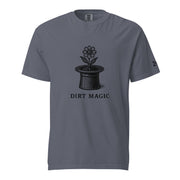 Black vintage-style illustration of a blooming flower growing from a magician's top hat with the words "Dirt Magic" beneath it, rendered in bold botanical line art inspired by classic storybook illustrations on a t-shirt.