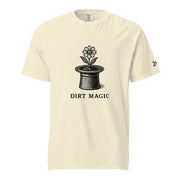 Black vintage-style illustration of a blooming flower growing from a magician's top hat with the words "Dirt Magic" beneath it, rendered in bold botanical line art inspired by classic storybook illustrations on a t-shirt.
