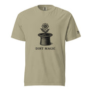 Black vintage-style illustration of a blooming flower growing from a magician's top hat with the words "Dirt Magic" beneath it, rendered in bold botanical line art inspired by classic storybook illustrations on a t-shirt.