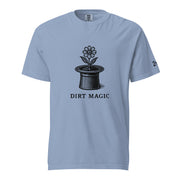 Black vintage-style illustration of a blooming flower growing from a magician's top hat with the words "Dirt Magic" beneath it, rendered in bold botanical line art inspired by classic storybook illustrations on a t-shirt.