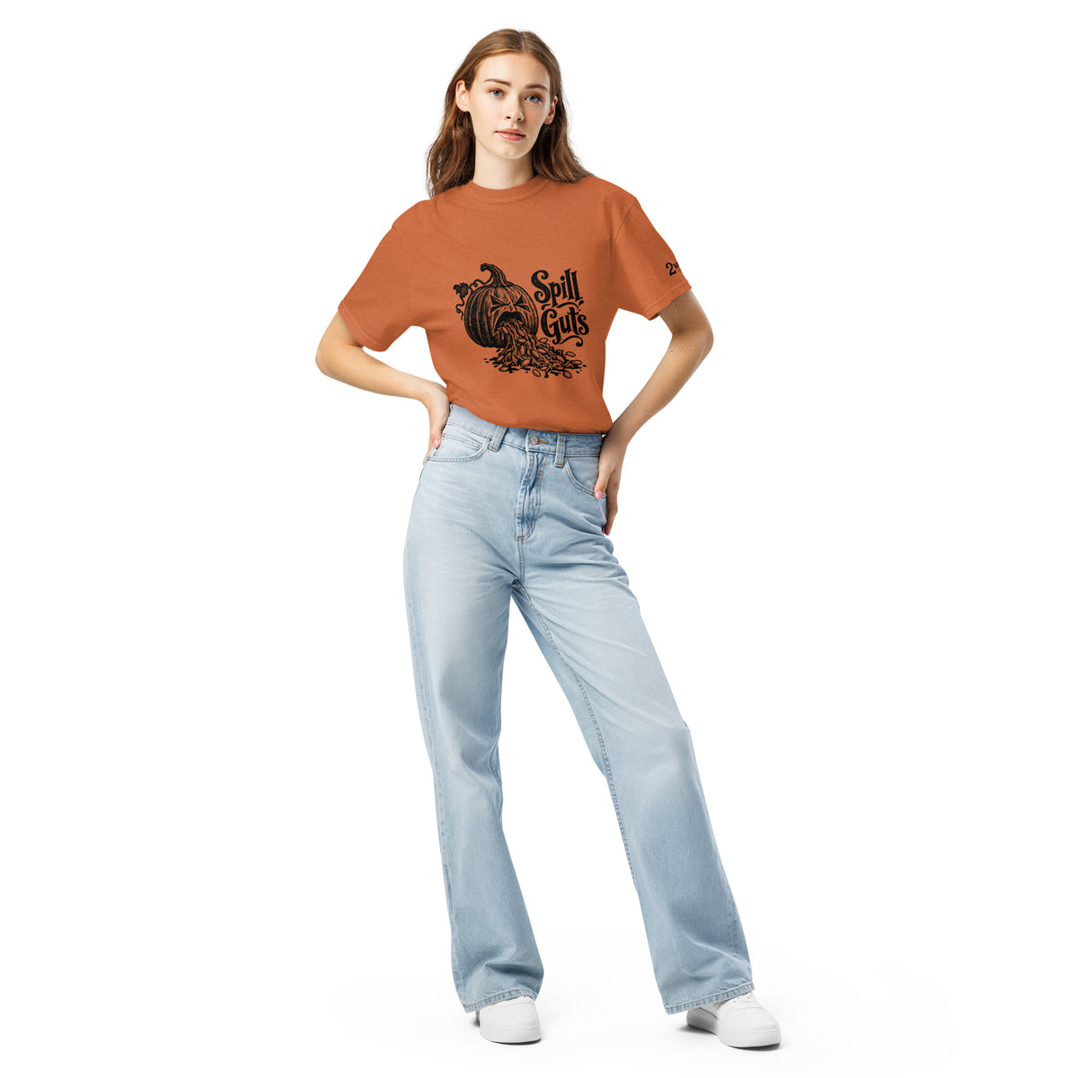 Spill Guts black ink illustration of an expressive carved jack-o'-lantern spilling stringy pumpkin pulp and seeds from its mouth beside decorative hand-lettered text on a unisex t-shirt.
