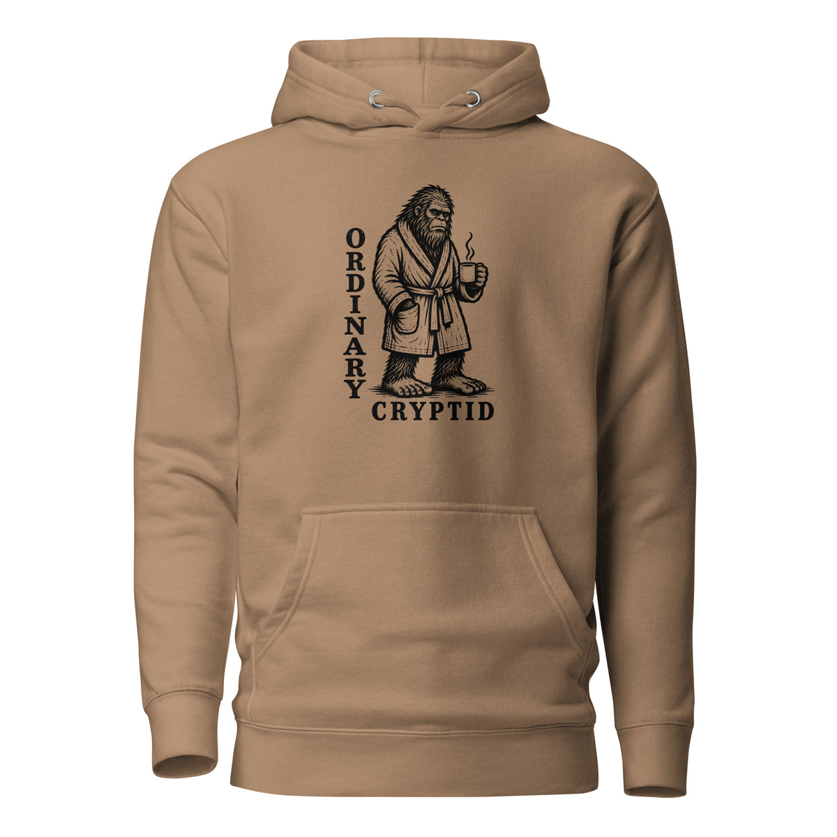 Black ink illustration of Bigfoot wearing a tied bathrobe and holding a steaming mug above the words “Ordinary Cryptid,” shown on a hoodie.