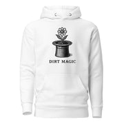 Black vintage-style illustration of a blooming flower growing from a magician's top hat with the words "Dirt Magic" beneath it, rendered in bold botanical line art inspired by classic storybook illustrations on a hoodie.
