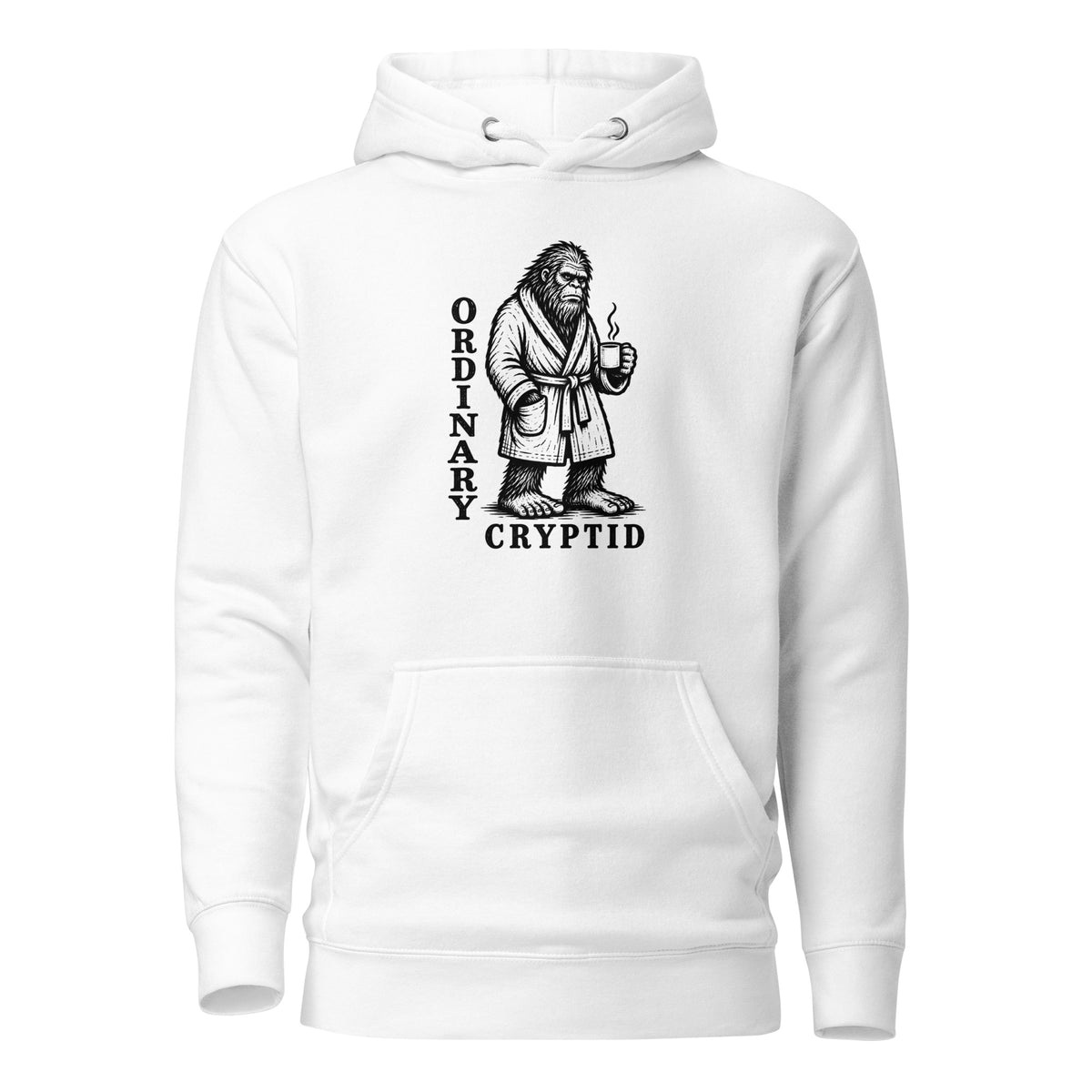 Black ink illustration of Bigfoot wearing a tied bathrobe and holding a steaming mug above the words “Ordinary Cryptid,” shown on a hoodie.