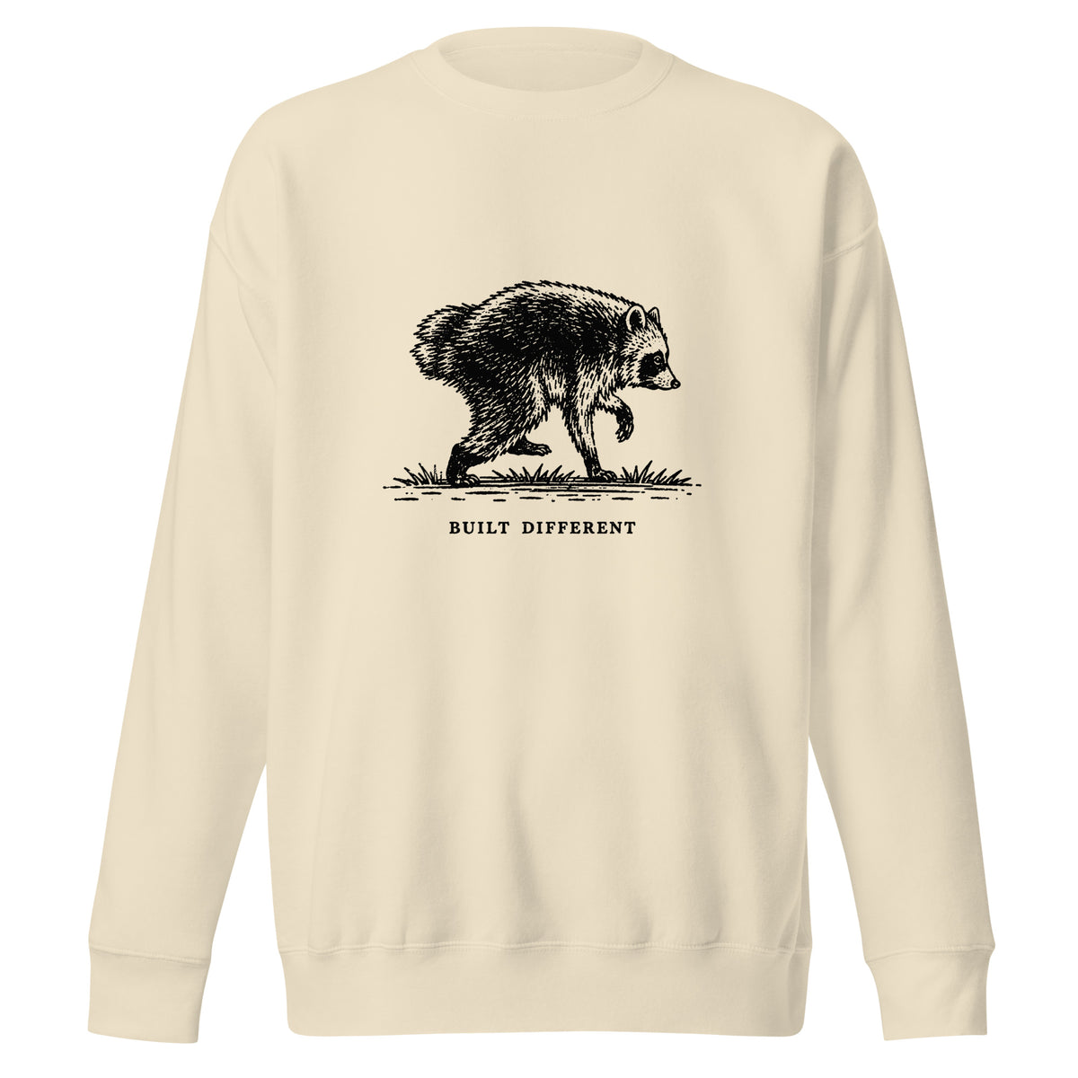 Vintage black-and-white illustration of a raccoon walking above the words "Built Different" on a sweatshirt.