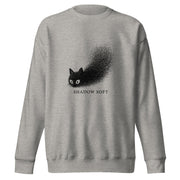 Shadow Soft black cat illustration with wide eyes disappearing into a large stippled black shadow, with vintage typography on a sweatshirt.

