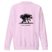 Vintage black-and-white illustration of a raccoon walking above the words "Built Different" on a sweatshirt.