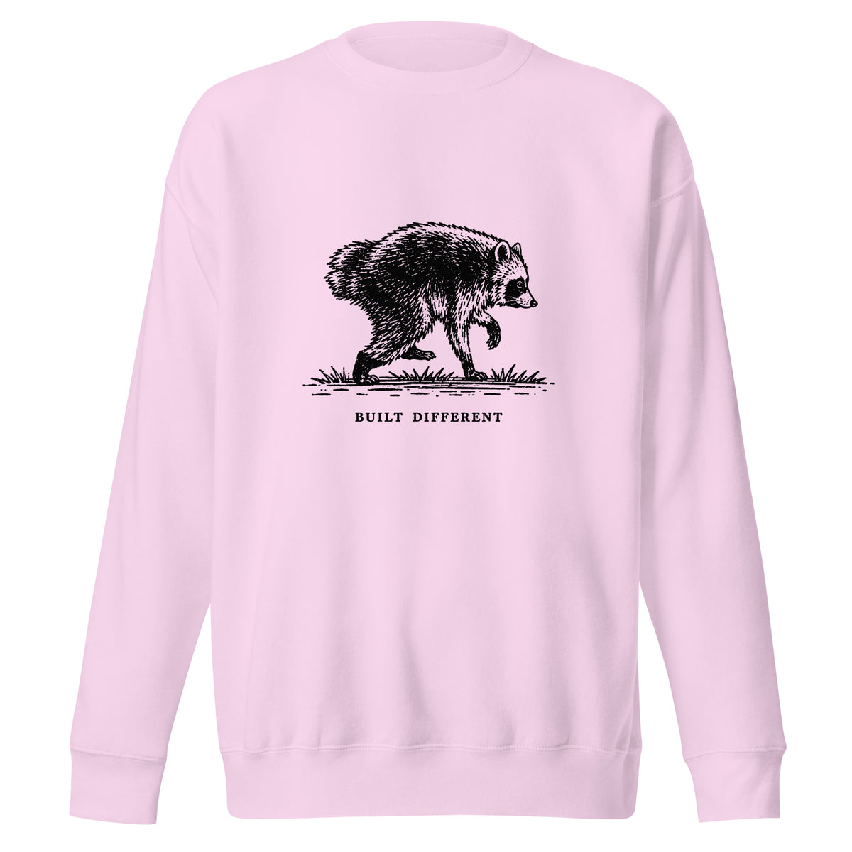 Vintage black-and-white illustration of a raccoon walking above the words "Built Different" on a sweatshirt.