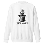 Black vintage-style illustration of a blooming flower growing from a magician's top hat with the words "Dirt Magic" beneath it, rendered in bold botanical line art inspired by classic storybook illustrations on a sweatshirt.
